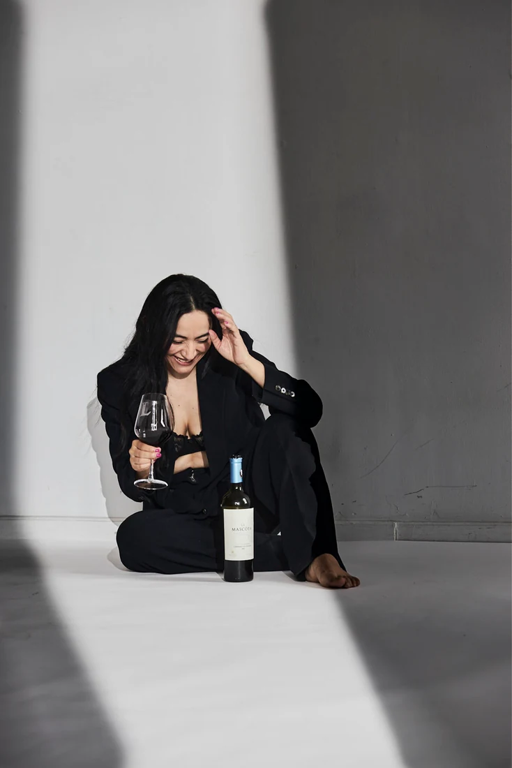 Lili in a black suit, in the studio — photograph 5493