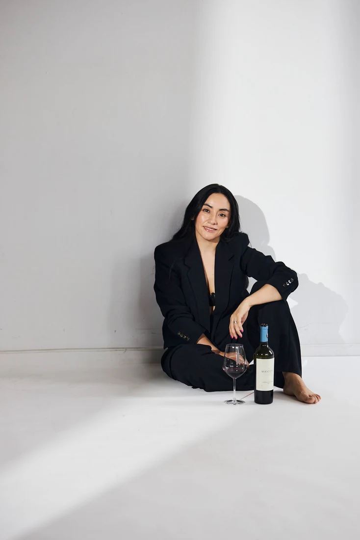 Lili in a black suit, in the studio — photograph 5521
