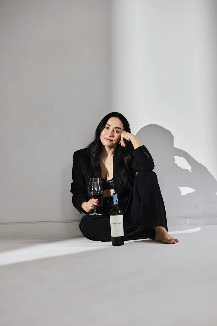 Lili in a black suit, in the studio — photograph 5525