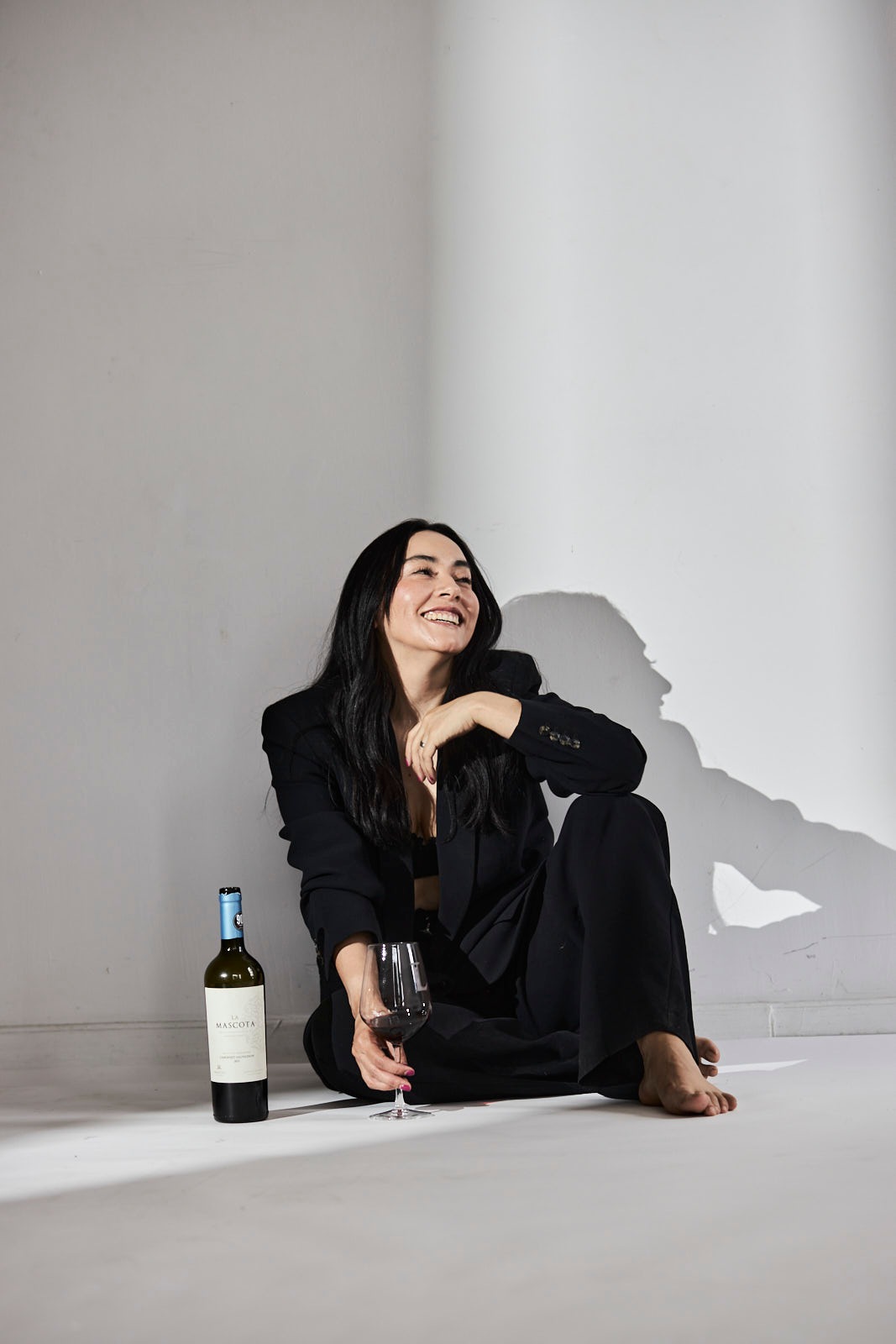 Lili in a black suit, in the studio — photograph 5528