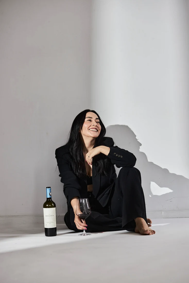 Lili in a black suit, in the studio — photograph 5528