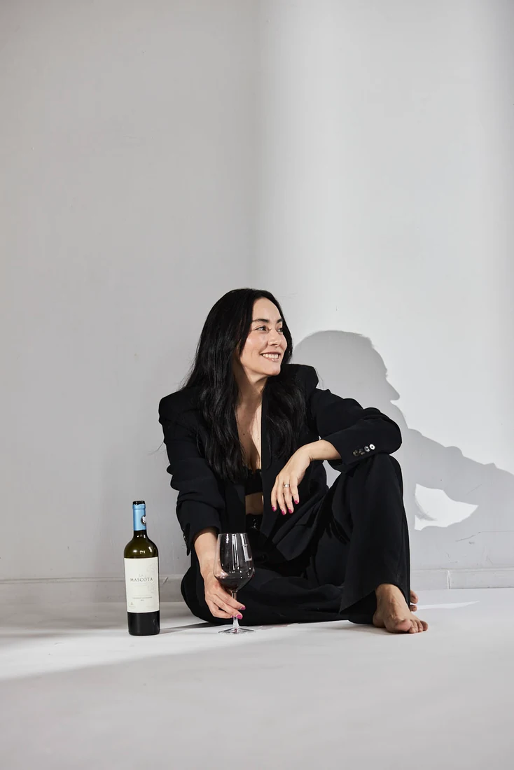 Lili in a black suit, in the studio — photograph 5529