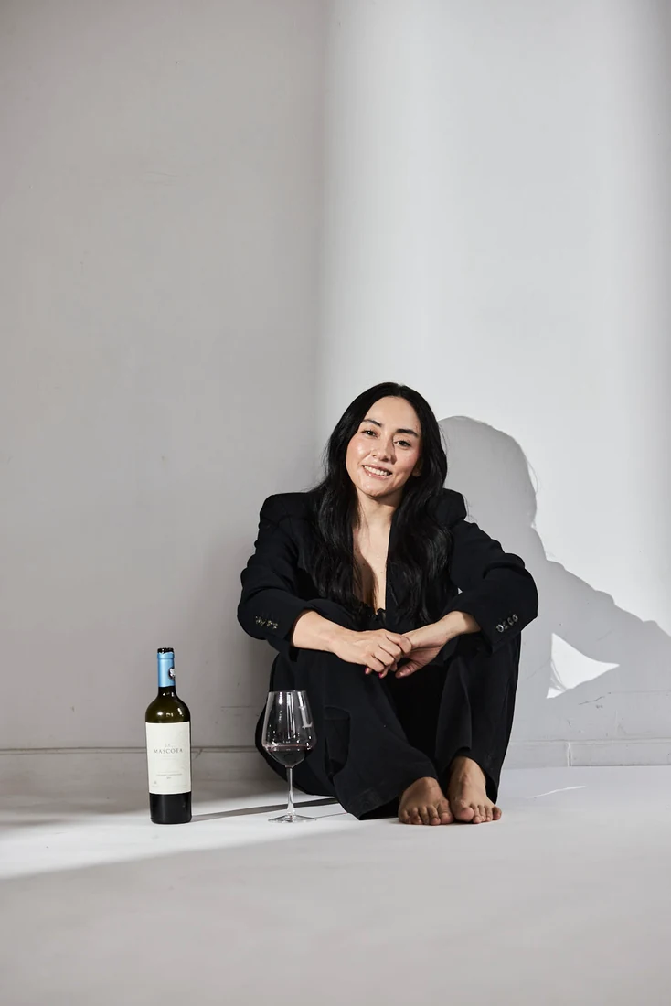 Lili in a black suit, in the studio — photograph 5533
