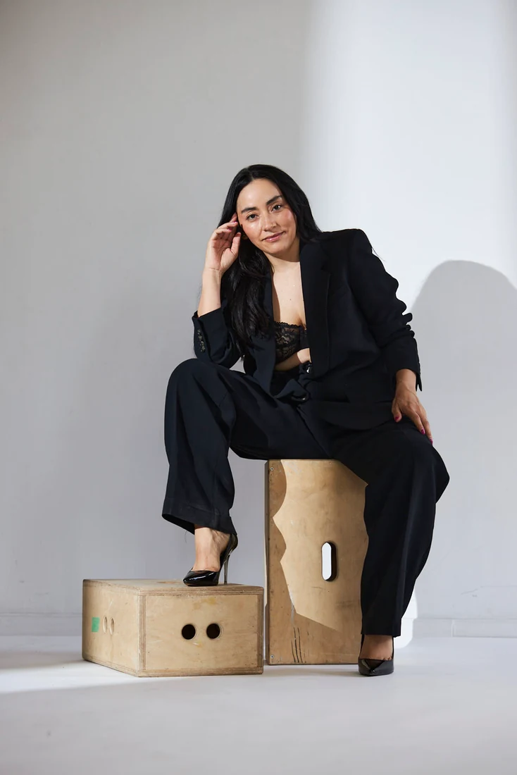 Lili in a black suit, in the studio — photograph 5541