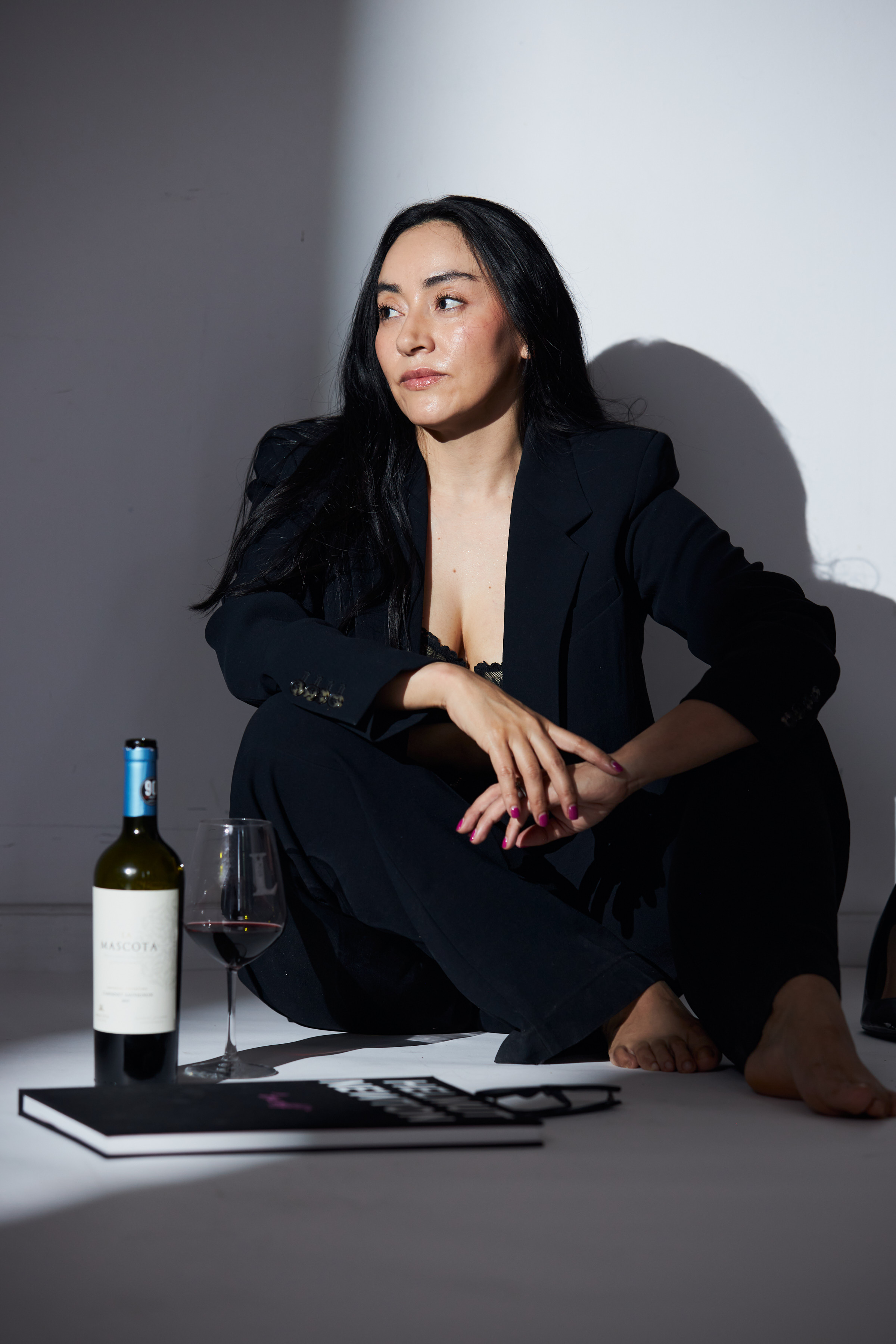 Lili in a black suit, in the studio — photograph 5660